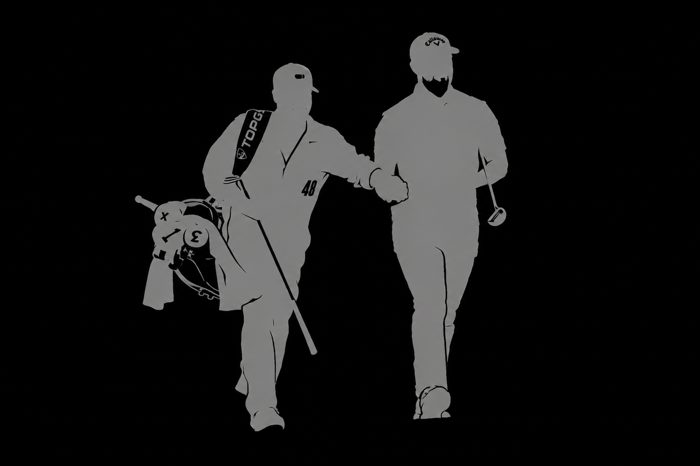 Golfer and caddie silhouette